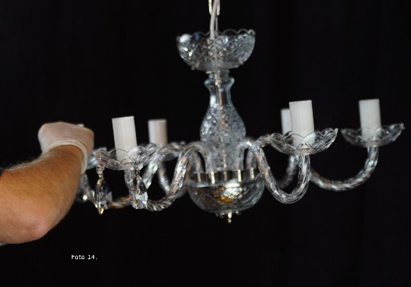 Installation of the crystal elements of the chandelier