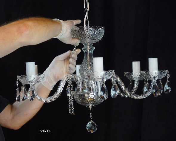 Attaching crystal chains to a chandelier